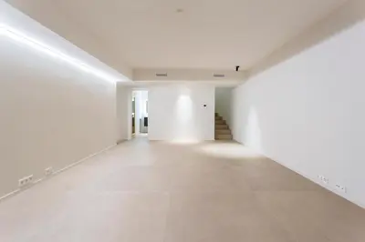 an empty room with white walls and a hallway at Villa Al Fresco Sitges Center and 10 minutes walk from beach Amaizing Design New Villa and new urbanization in Sitges