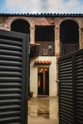 an entrance to a building with a black gate at Habitación Sant Jeroni en Casa Camí de les Aigües Monistrol de Montserrat in Monistrol
