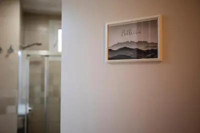 a picture hanging on a wall in a bathroom at Habitación Montgros en Casa Camí de les Aigües Monistrol de Montserrat in Monistrol