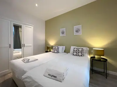 a bedroom with two beds with towels on them at Stay U-nique Apartments Rossello in Barcelona