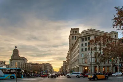 a busy city street with cars and buildings at Victoria City Center Barcelona in Barcelona