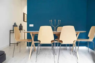 a dining room with a table and four chairs at SAGRADA FAMILIA SUN Nos preocupa su seguridad in Barcelona