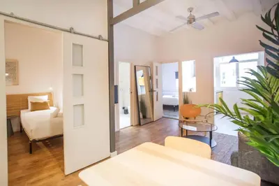 a living room with a table and a couch at Fantástico piso en Barcelona in Barcelona