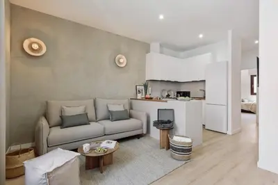 a bedroom with a bed with a tray of food on it at Vietri - 2 bedrooms and terrace in Sant Antoni in Barcelona