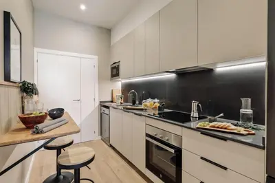 a living room with a flat screen tv on a wall at Castell - 2 bedrooms and balcony in Sant Antoni in Barcelona
