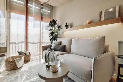 a dining room with a table and a mirror at Canyelles - 2 bedrooms in Sant Antoni in Barcelona