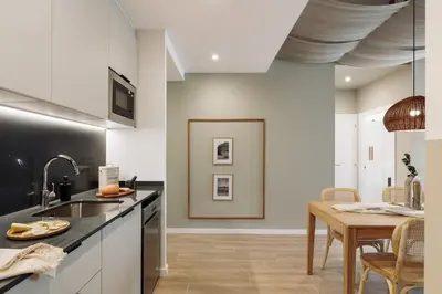 a living room with a couch and a window at Canyelles - 2 bedrooms in Sant Antoni in Barcelona