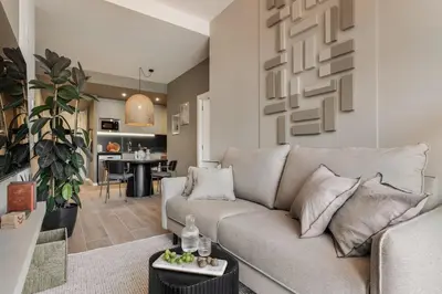 a dining room and living room with a table and chairs at Vent - 2 bedrooms in Sant Antoni in Barcelona