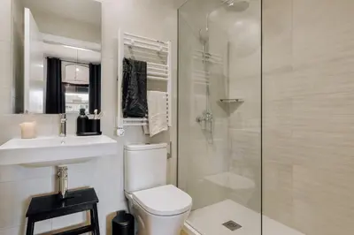 a bedroom with a bed and a large window at Miravet - 2 bedrooms in Sant Antoni in Barcelona