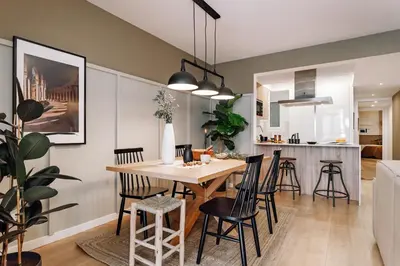 a living room with a couch and a table at Loja - 2 bedrooms in Sant Antoni in Barcelona