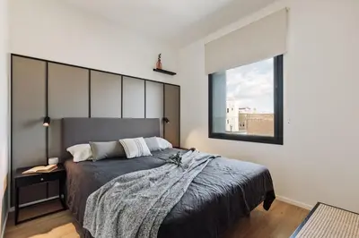 a kitchen and living room with a view of a city at Serrat - 1 bedroom and office in Poblenou in Barcelona