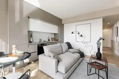 a living room with a couch and a tv at Serrat - 1 bedroom and office in Poblenou in Barcelona