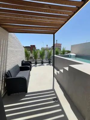 a patio with a couch and a swimming pool at esplugues de llobregat in Barcelona