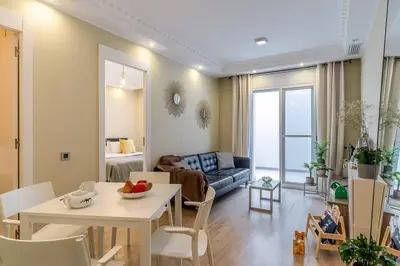 a living room with a couch and a table at Canela Homes BARCELONA SANT PAU in Barcelona