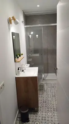 a bathroom with a sink and a shower at Cal 2 de Maig in Vilafranca del Penedès