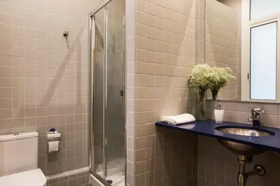 a bathroom with a sink and a shower at Born Barcelona Hostel in Barcelona