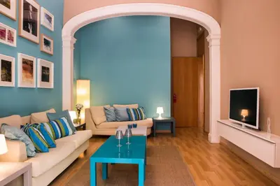 a living room with a couch and a table at Born Barcelona Hostel in Barcelona