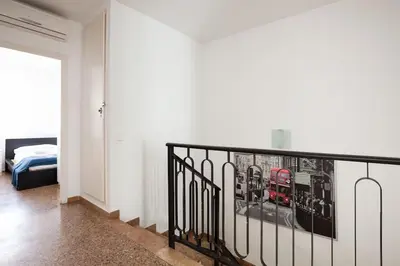 a room with a staircase with a picture on the wall at Canela Homes BARCELONA AUSIAS MARC in Barcelona