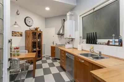 a kitchen with a sink and a counter top at Canela Homes BARCELONA CLASSIC in Barcelona