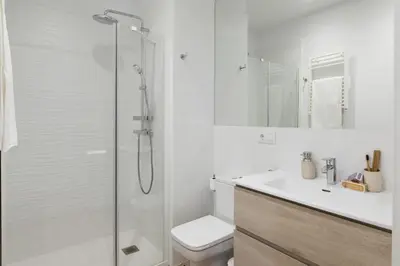a bathroom with a shower and a toilet and a sink at Casa Ribera in Barcelona