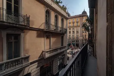 a view of a street from a balcony of a building at Casa Tapiz in Barcelona