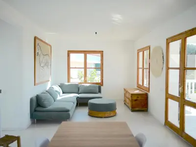 a living room with a couch and a table at Apartamento nuevo muy luminoso in La Crehueta