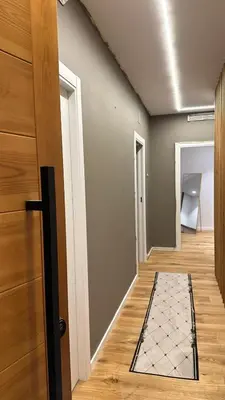 a hallway with a door and a door mat on the floor at chalet barcelona in Barcelona
