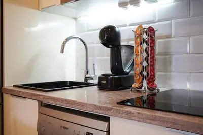 a kitchen counter with a sink and a coffee maker at Apartment-4people-Parking-Castelledefels-Bikes-Bbq in Castelldefels