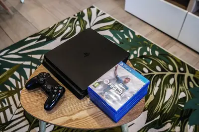 a table with a laptop and a video game controller at Apartment-4people-Parking-Castelledefels-Bikes-Bbq in Castelldefels