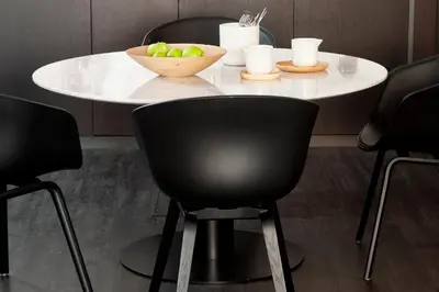 a white table with a bowl of apples on it at The Passage Homes - Simaba Group in Barcelona