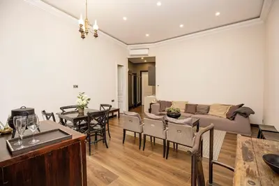 a living room with a couch and a table at beautiful trendy spacious apartment very central location in Barcelona