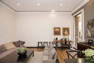 a living room with a couch and a table at beautiful trendy spacious apartment very central location in Barcelona