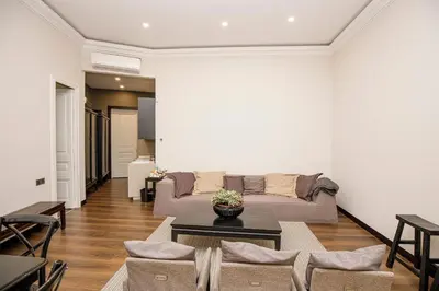 a living room with a couch and a table at beautiful trendy spacious apartment very central location in Barcelona
