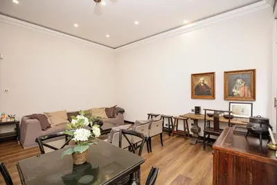 a living room with a couch and tables and chairs at beautiful trendy spacious apartment very central location in Barcelona