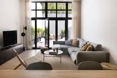 a living room with a couch and a table at Casa Mercader - Simaba Group in Barcelona