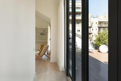a room with a balcony with a view of a building at Casa Mercader - Simaba Group in Barcelona