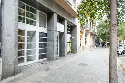 an empty street in front of a building at Winahost Barcelona Provenza in Barcelona