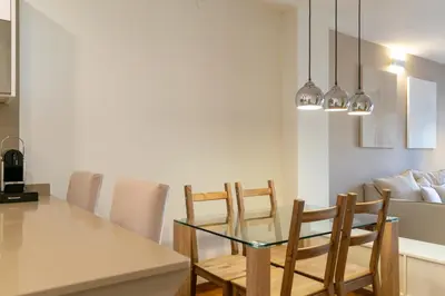 a dining room with a glass table and chairs at 