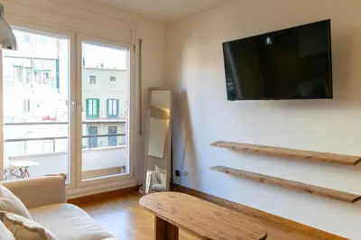 a living room with a flat screen tv on a wall at 