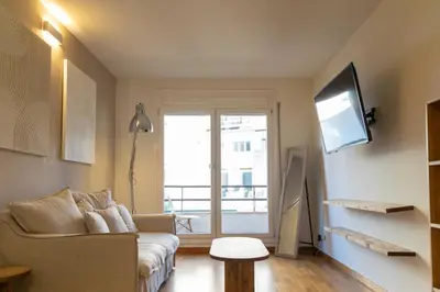 a living room with a couch and a flat screen tv at 