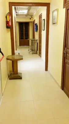 an empty hallway with a table in a room at Hostal Capitol Ramblas in Barcelona