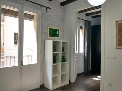 a room with a white door and a window at Barceloneta Beach Apartments in Barcelona