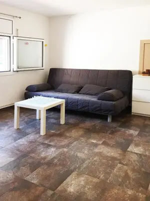 a living room with a couch and a coffee table at Eco house of oak, 15 min to BCN Max Pax 8 in Sant Cugat del Vallès