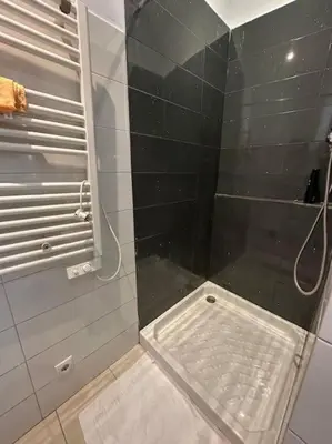 a shower with a glass door in a bathroom at Casa Vallromanes Rest House in Vallromanas