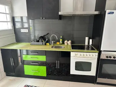 a kitchen with a sink and a stove at Casa Vallromanes Rest House in Vallromanas