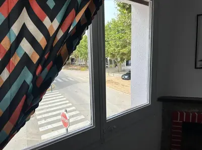 a window with a view of a street at Casa Vallromanes Rest House in Vallromanas