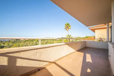 a balcony with a view of the ocean at Villa Sitges Cambera 10 minutos de Playa andando Muy Comoda Area Tranquila in Sitges