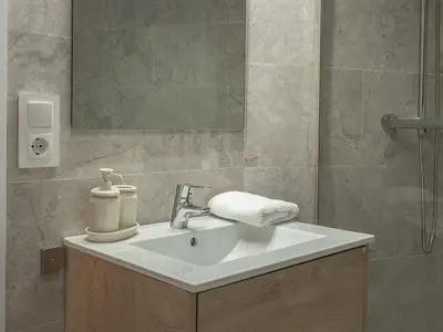 a bathroom with a white sink and a mirror at Sagrada Familia's View 3B1 5Bath in Barcelona