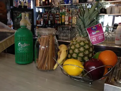 a counter with a bowl of fruit and a jar of pasta at The Hotel 592 - Adults Only in Barcelona