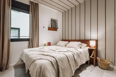 a bedroom with a bed with two books on it at Mojacar - 2 bedrooms in Eixample Esquerra in Barcelona